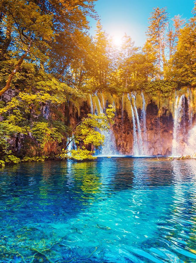 Summer background with lake and waterfall in forest KAT-70
