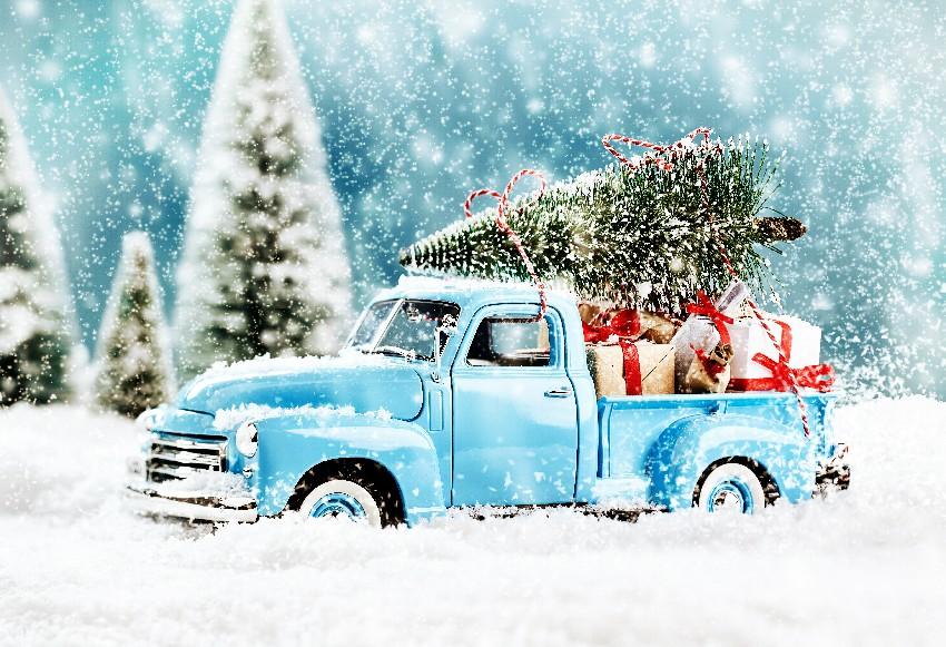 Christmas Background With A Car Full of Gifts in Heavy Snow 